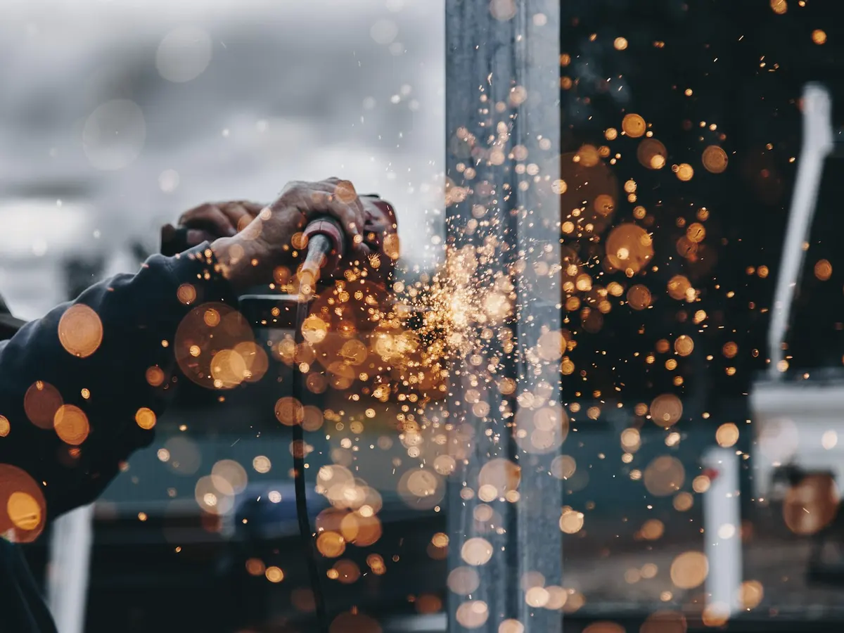 Sparks flying from a grinder in a workshop